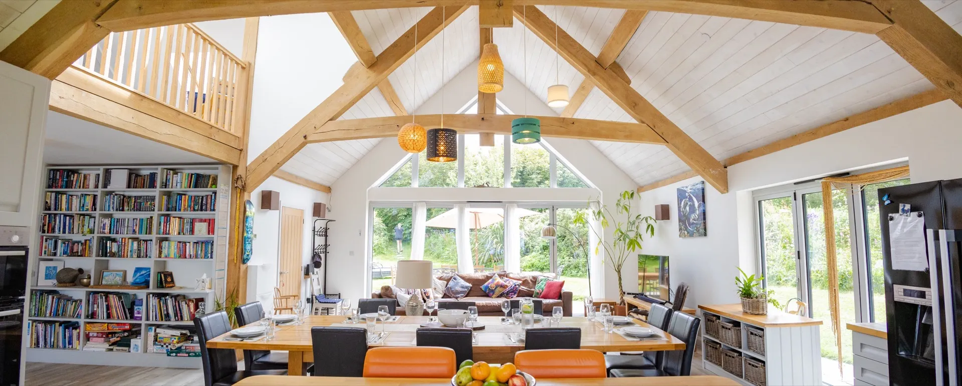 Vaulted oak frame ceiling and open-plan interior of a home built by Woodcraft in North Devon