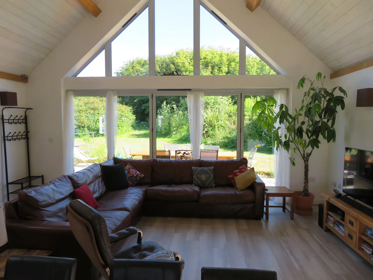 Open-plan living area beneath the oak frame