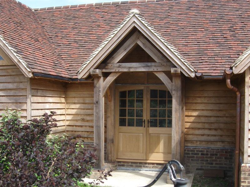 Oak framed porch brick house