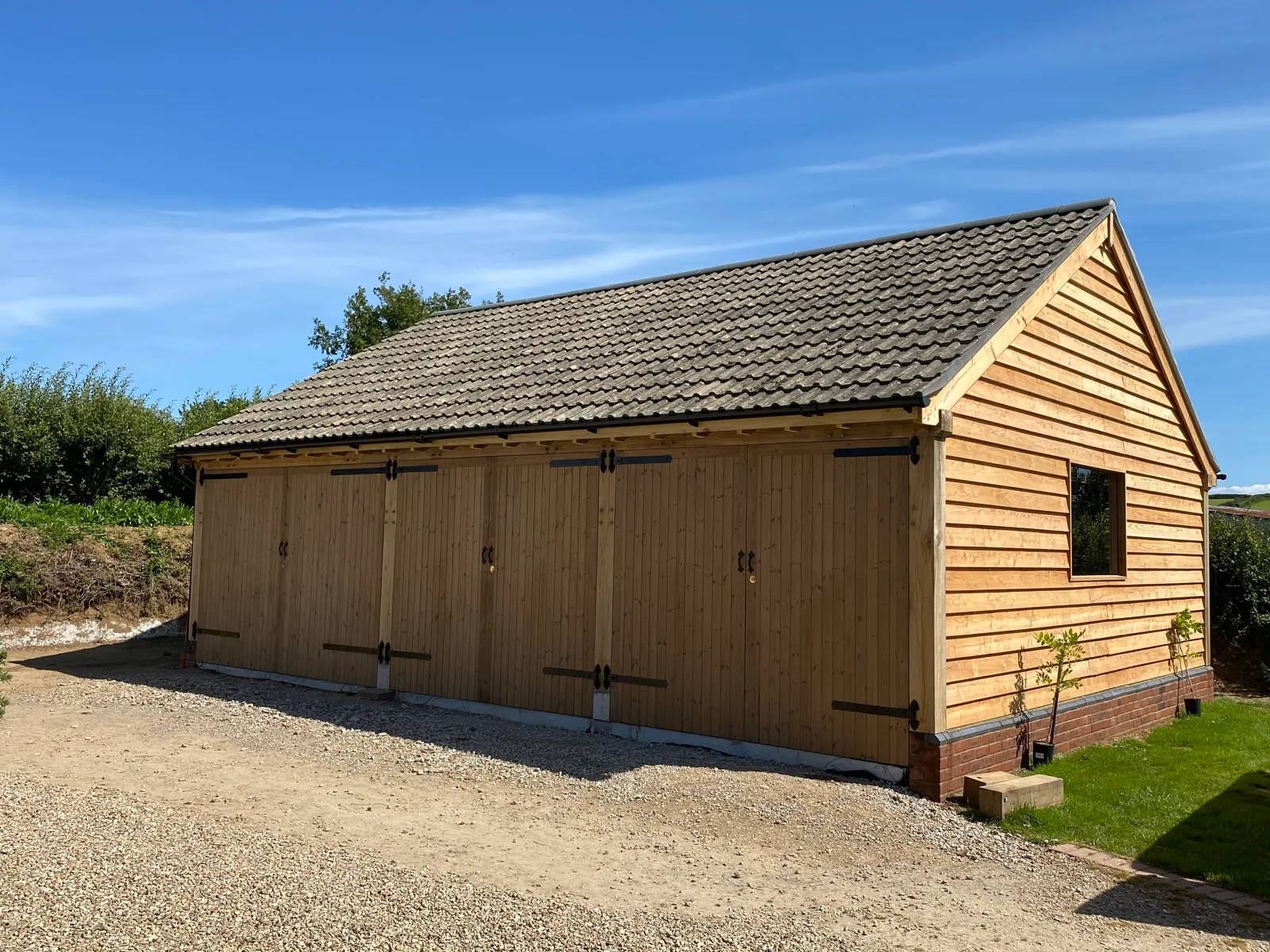 Oak framed two bay carport classic car