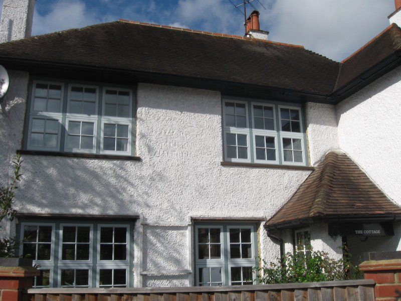 Timber windows tile hung house